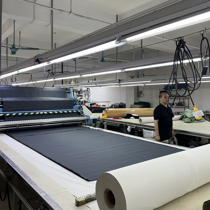 Custom Clothing Manufacturer worker garment pressing finished apparel